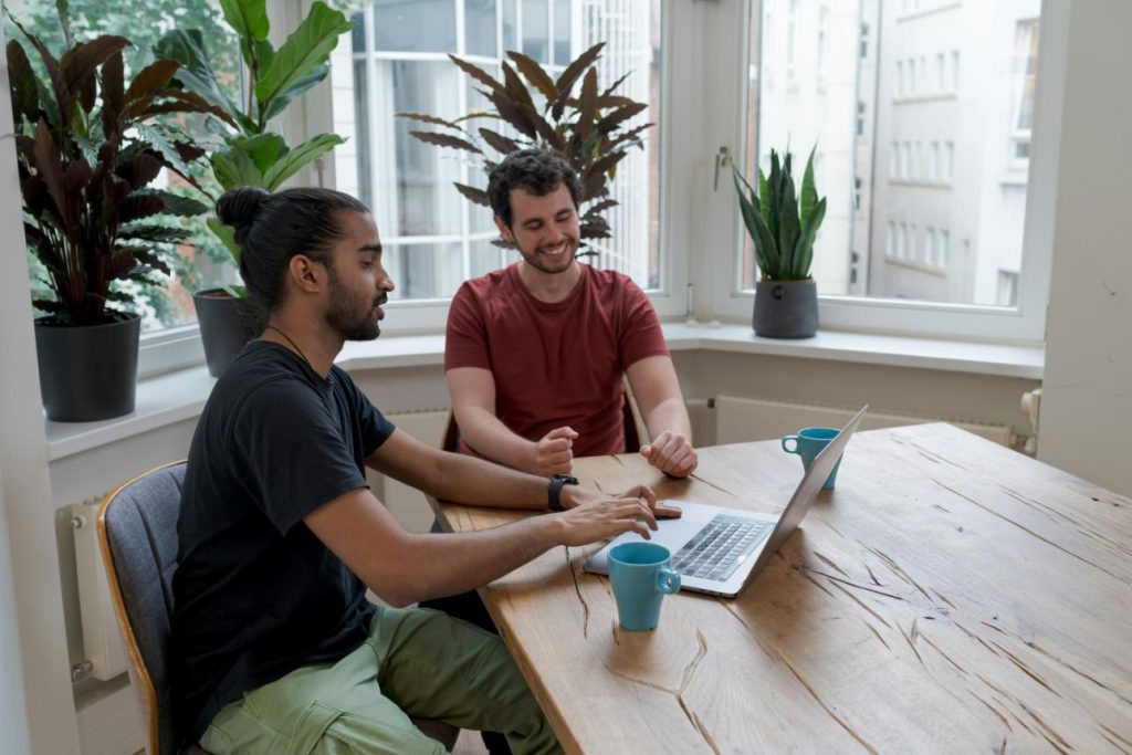 Two people collaborating at table