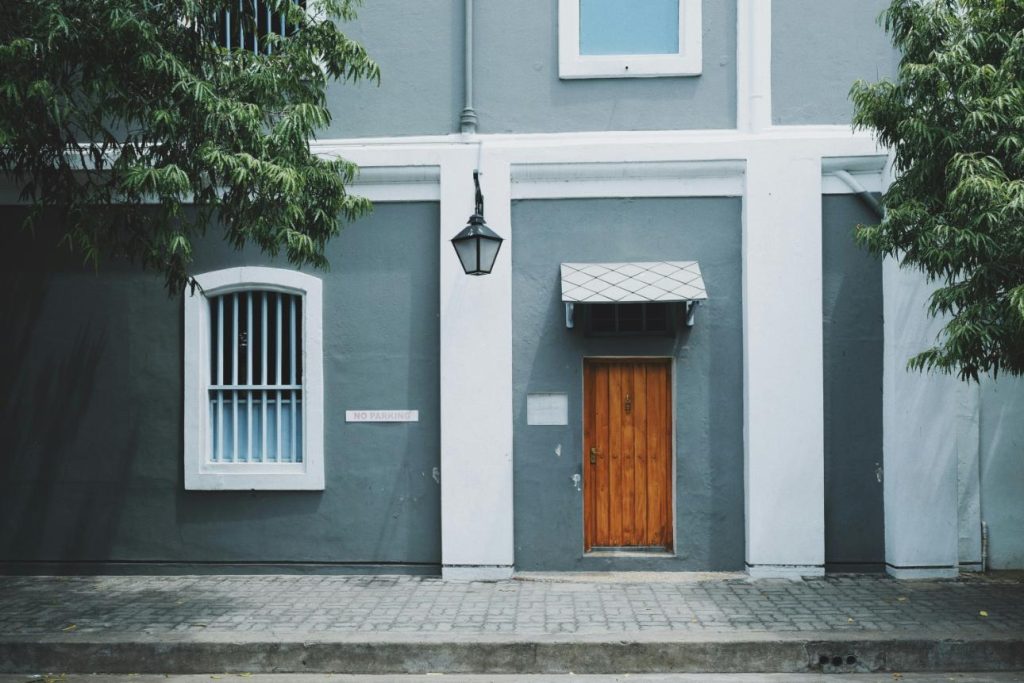 Gray building with wooden door