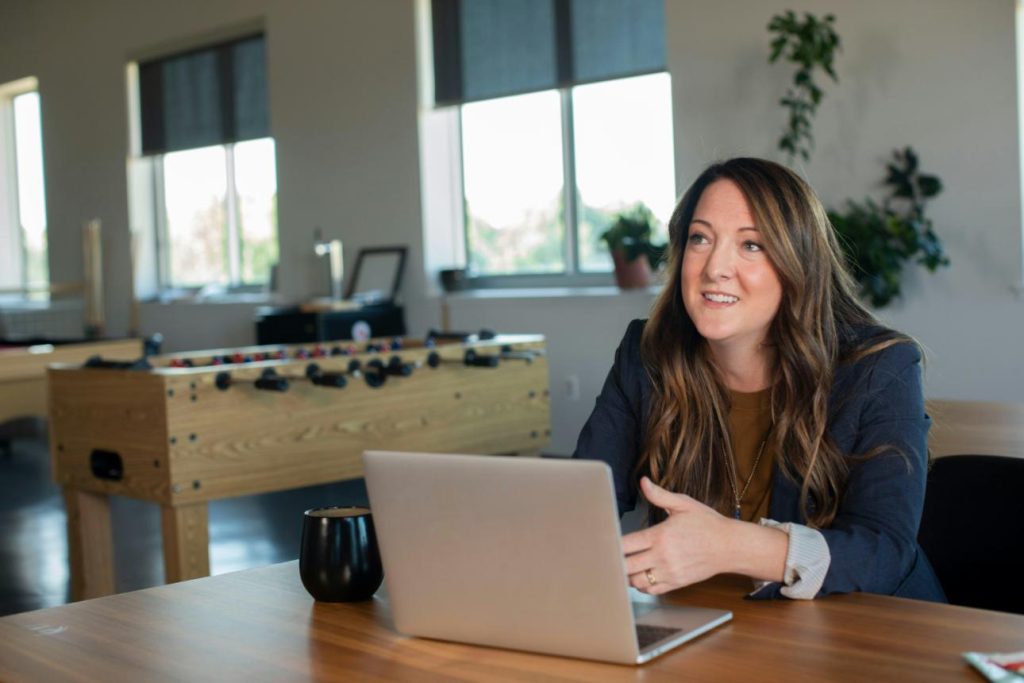 Woman smiling at laptop