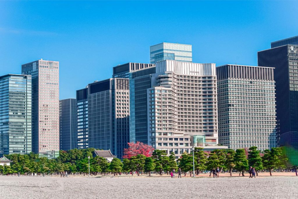 City skyline with greenery