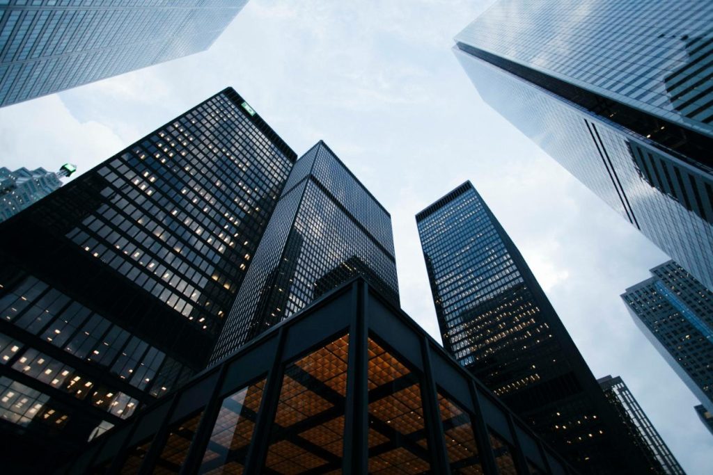 Skyscrapers against cloudy sky